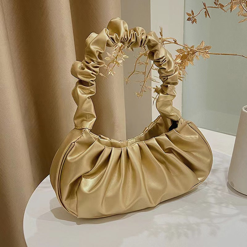Foreign trade Korean version women's bag 2022 new solid color cloud pleated bag simple women's armpit bag sweet shoulder bag